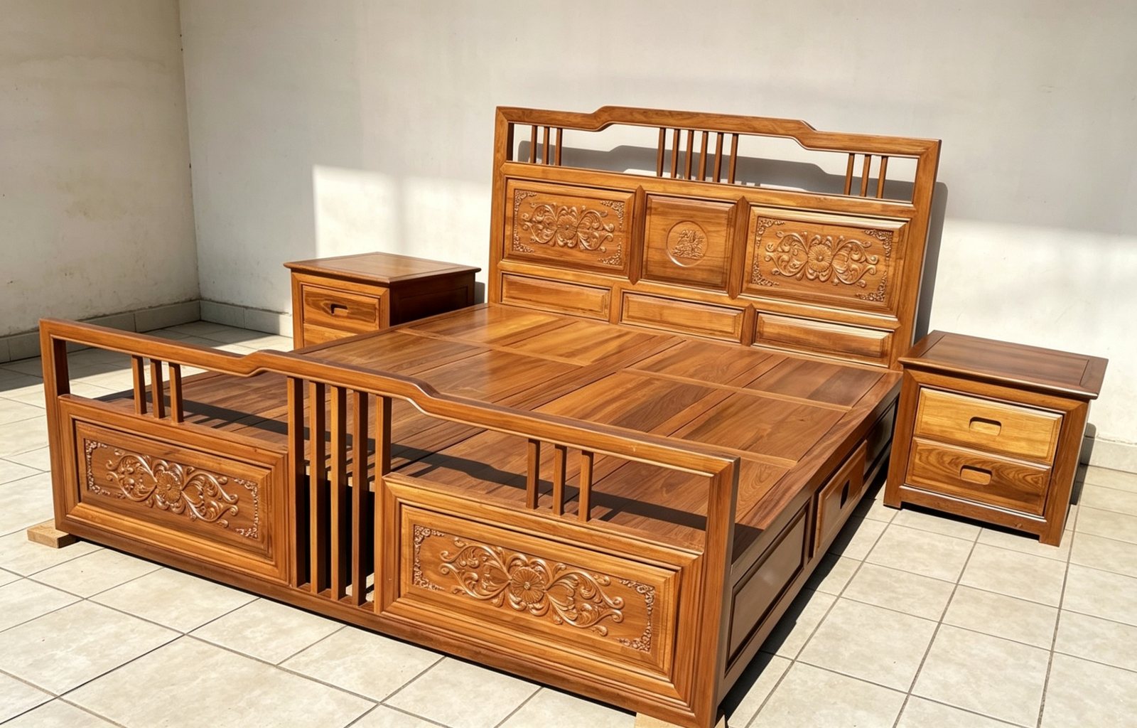 Finished carved teak bed styled in a bright bedroom