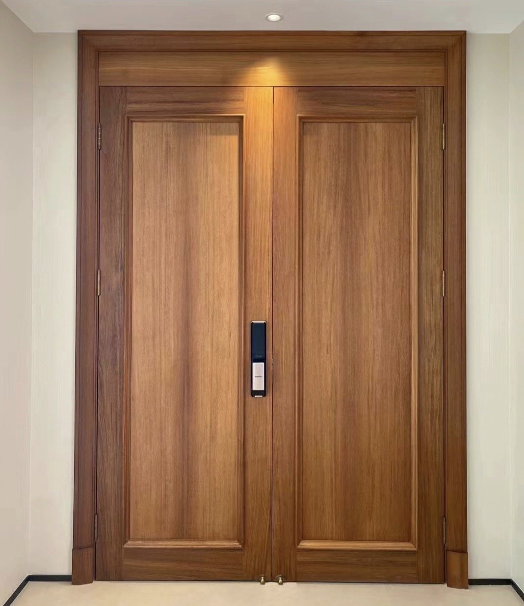 Oiled teak entrance door catching natural light