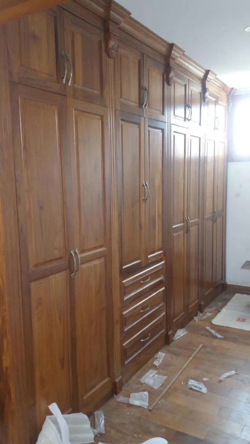 Hand-cut dovetail teak drawers in a custom wardrobe